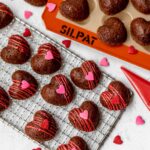 Heart-shaped cookies on the wire rock.