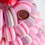 Macarons tower with pink and purple macarons.