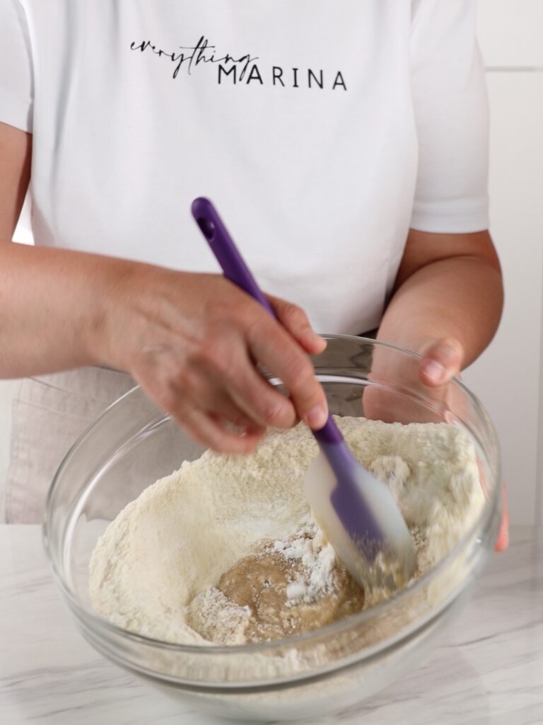 Almond flour and egg whites in the mixing bowl.