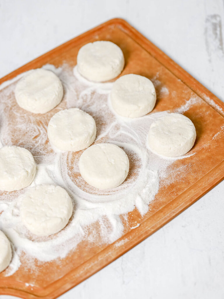 Syrniki on the cutting board.
