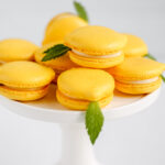 Lemon-shaped macarons on the cake stand.