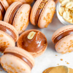 Chocolate peanut butter macarons are on the table.