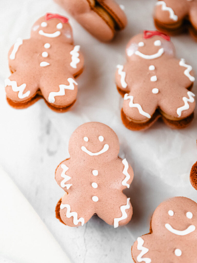 Gingerbread man Macarons on the table. 