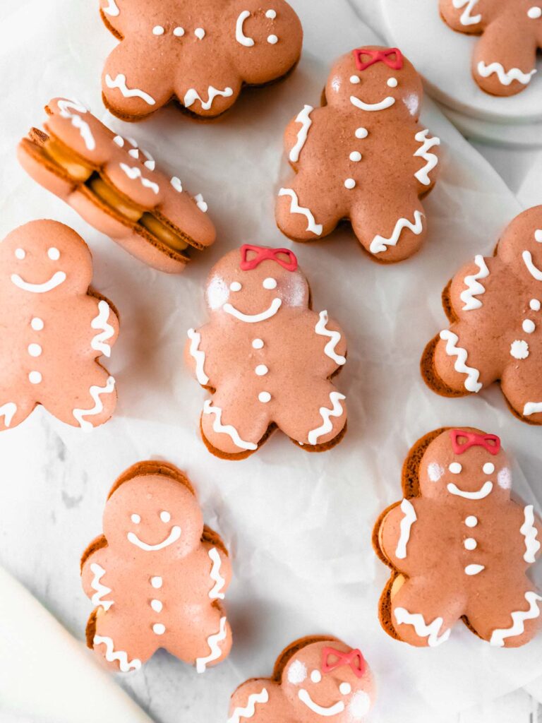 Gingerbread man Macarons on the table. 