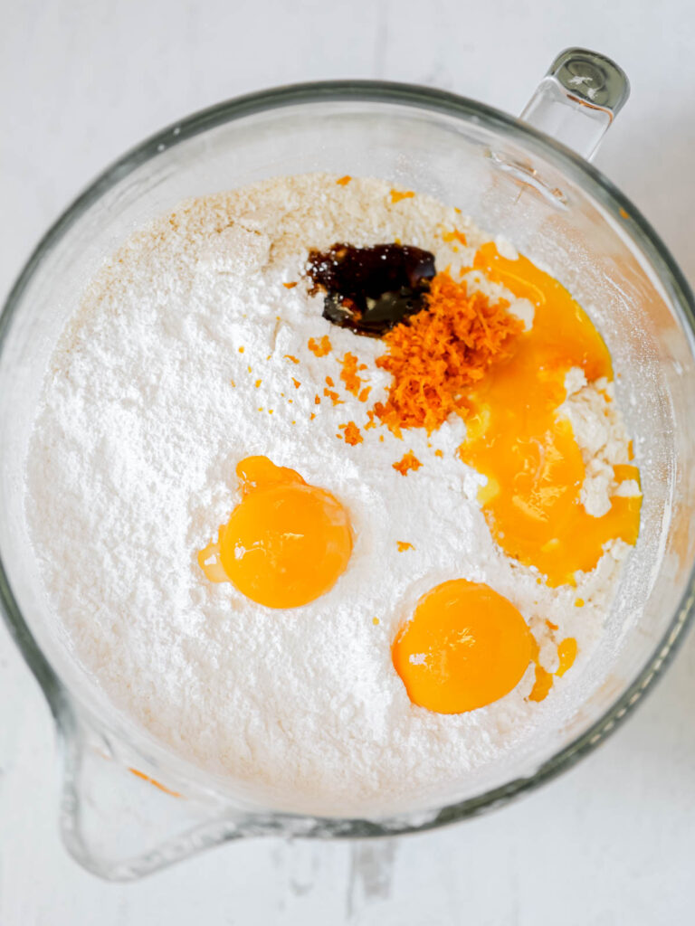 Dry ingredients and egg yolks in the mixing bowl. 