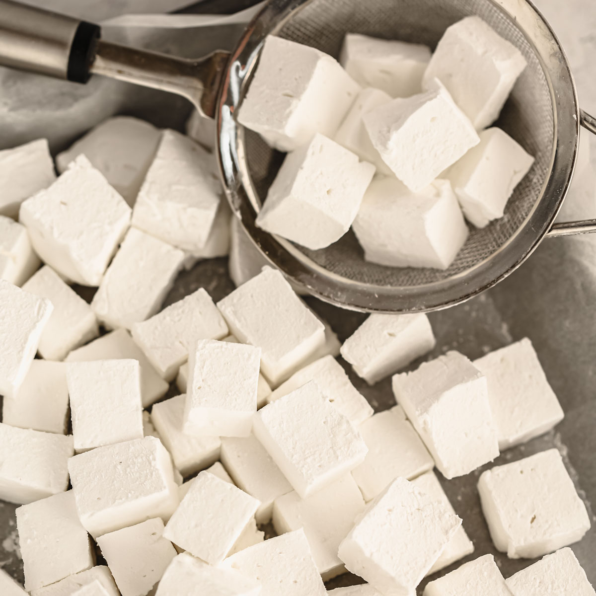 Homemade marshmallows cut into pieces.