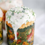 Bread decorated with white icing and sprinkles.