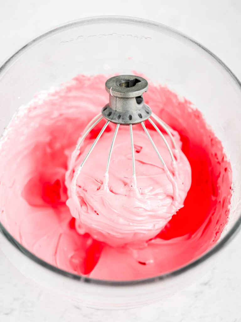French meringue on the whisk in the bowl. 