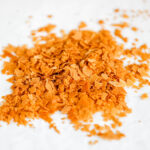 Feuilletine flakes on the parchment paper.