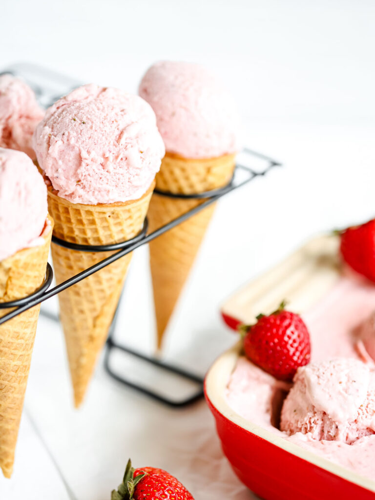 Ice cream cones with strawberry ice cream. 