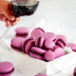 Purple macarons in the white box.