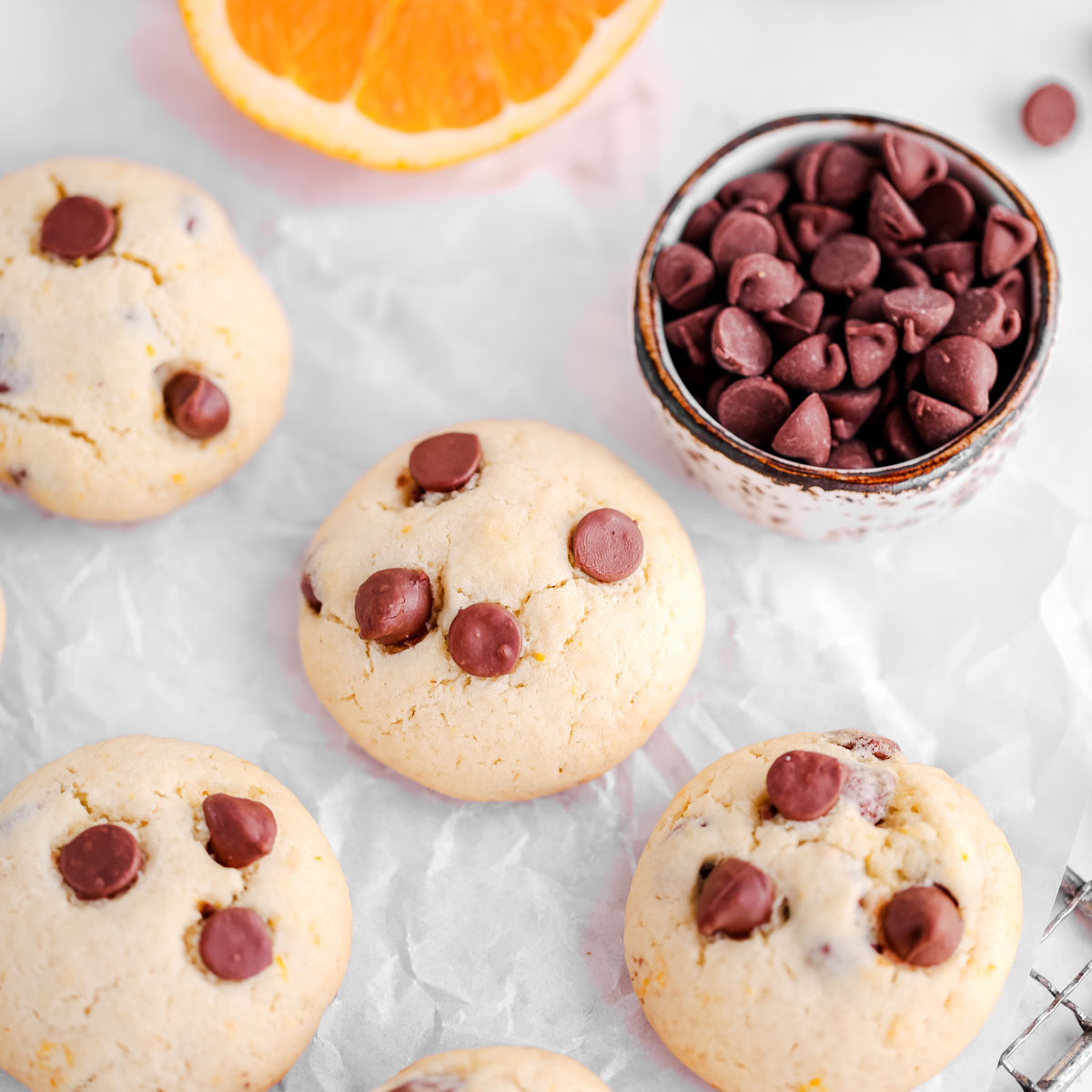 Orange chocolate chip cookies on the table.
