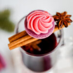 Mulled Wine ganache piped on a Macaron shell.