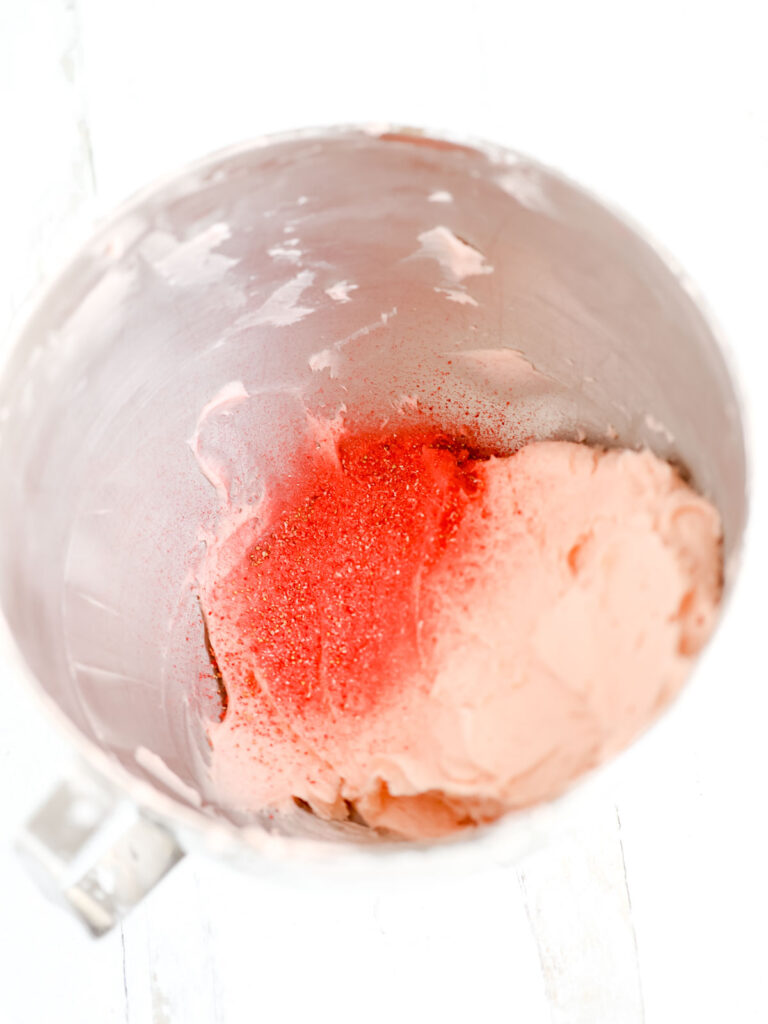 Mixing bowl with buttercream and Strawberry powder. 