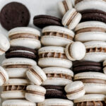 White macarons with Oreo cookies in the box.
