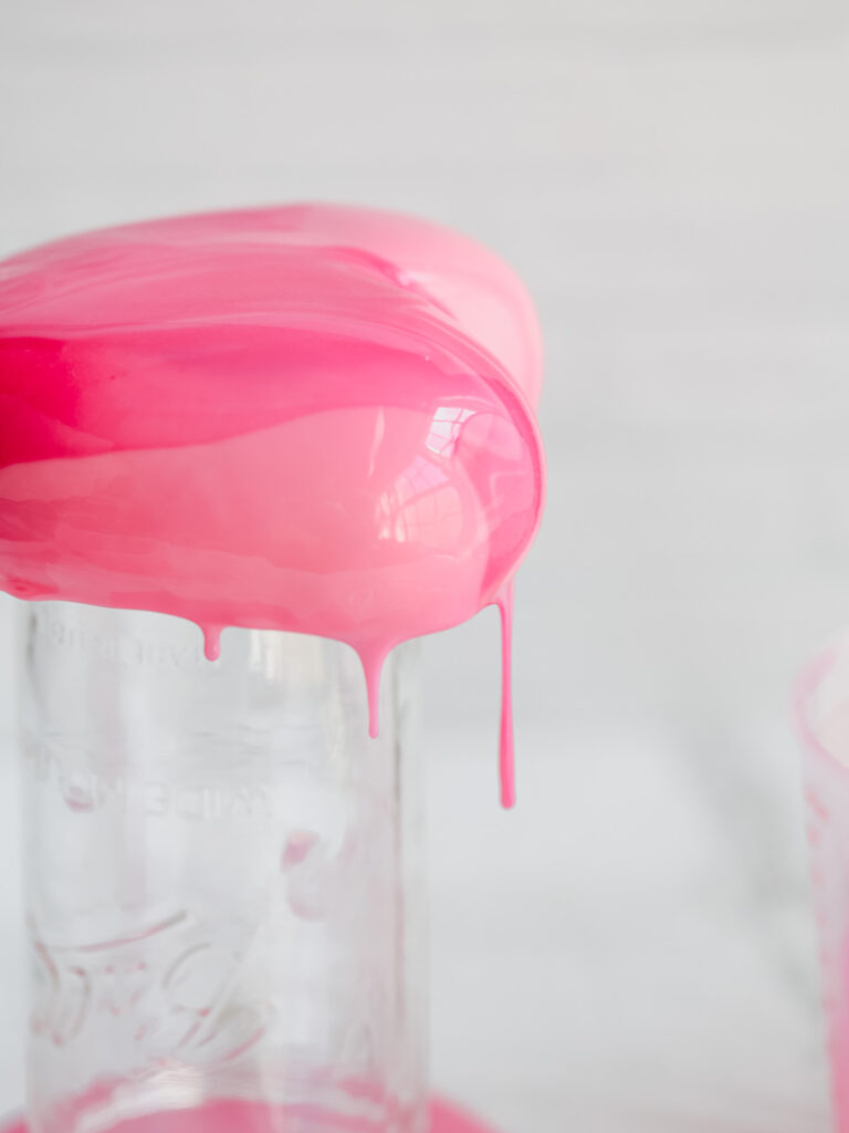 Mousse cake covered with pink mirror glaze.