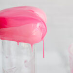 Mousse cake covered with pink mirror glaze.