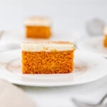 A piece of pumpkin cake on the plate.