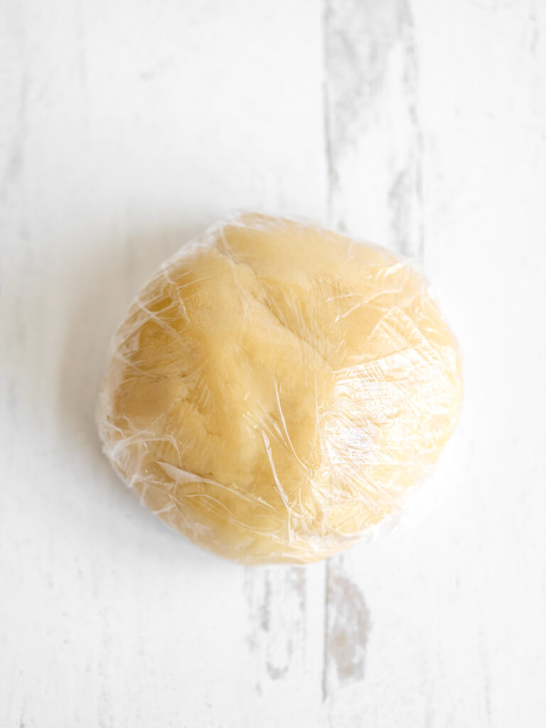 Crust dough in the plastic wrap. 