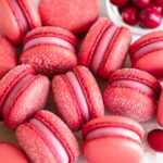 Cranberry macarons on the table.