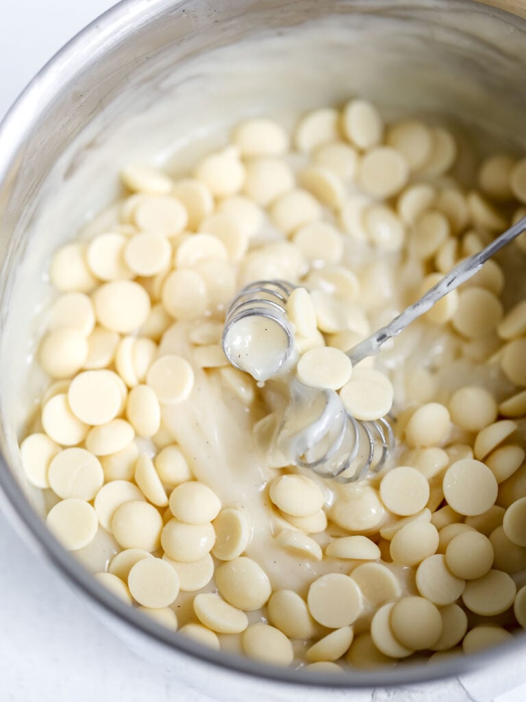 White chocolate in the saucepan with pastry cream.