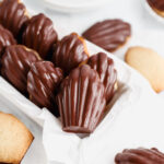 Madeleine cookies are covered with chocolate.