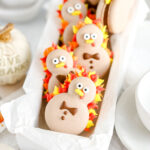 Macarons are shaped like turkeys and decorated with royal icing.