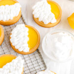Lemon tarts decorated with meringue on the table.
