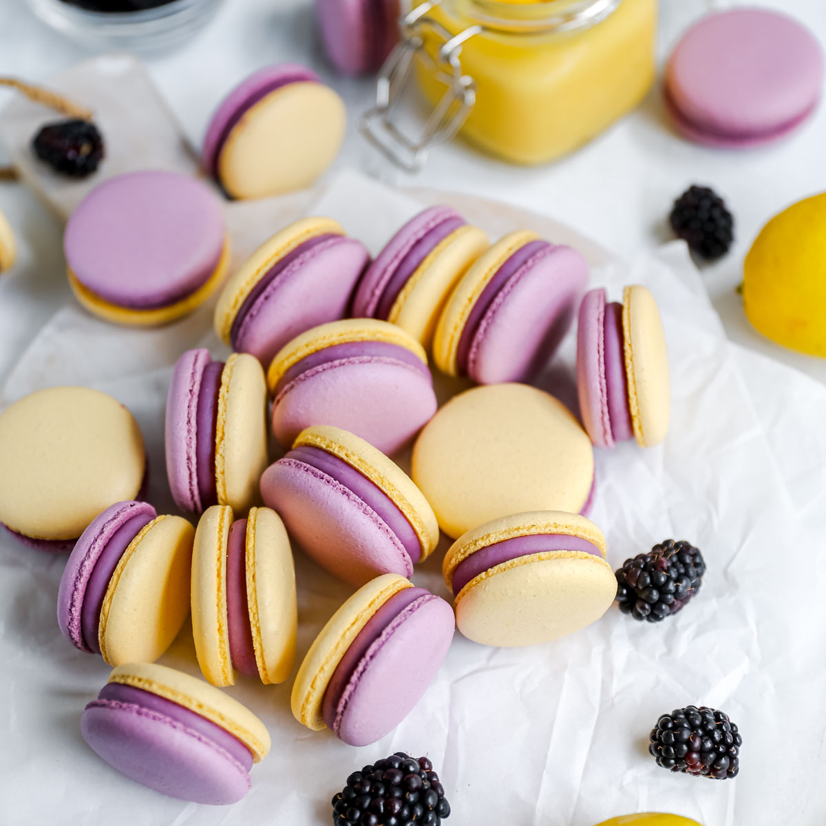 Purple and yellow macarons on the table.