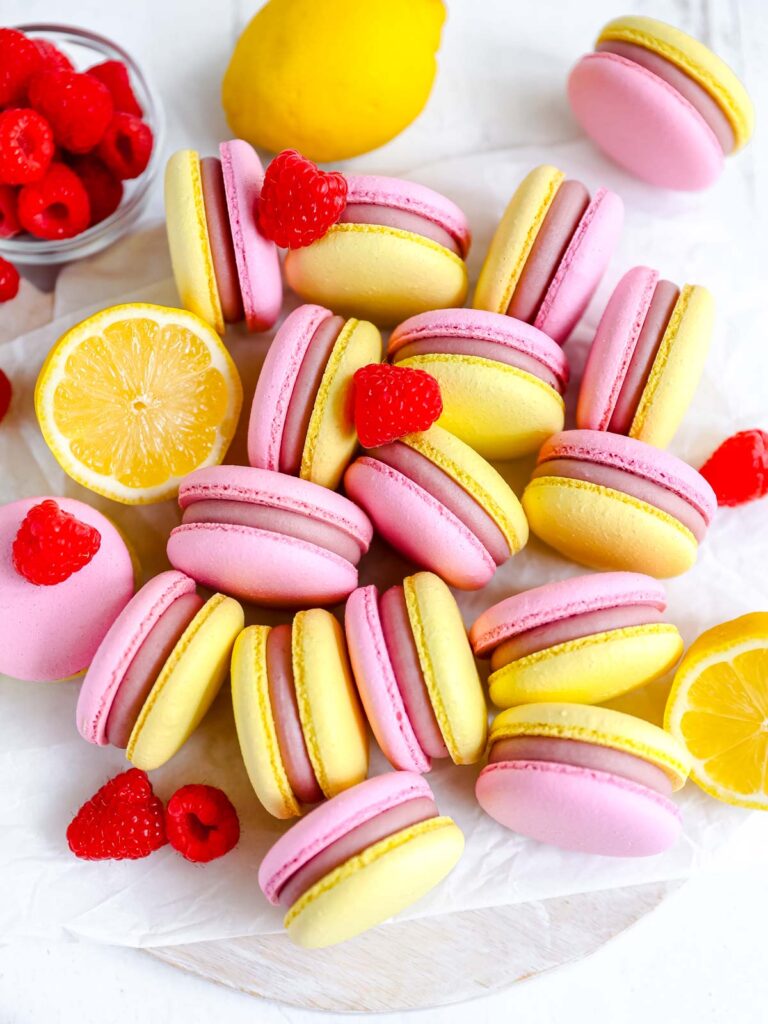 Yellow and pink macarons on the table. 