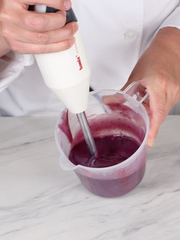 Emulsify ganache with an immersion blender. 