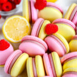 Pink and yellow macarons on the table.