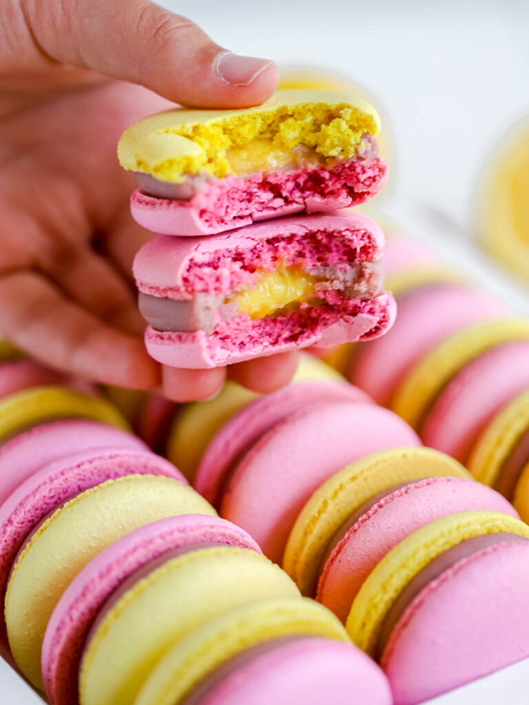 Raspberry Lemon Macarons in the hands. 