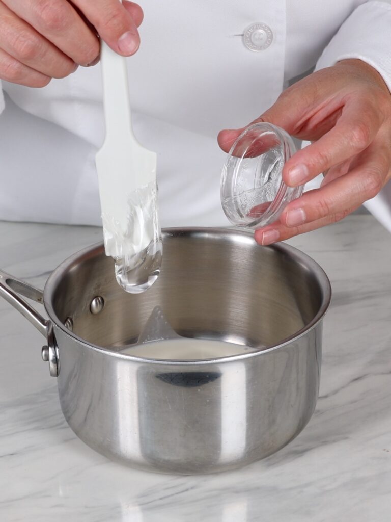 Saucepan with heavy cream. 
