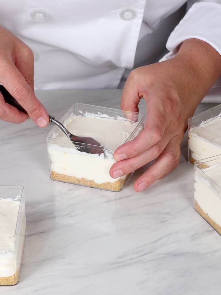 Level the cheesecake filling with the spatula. 