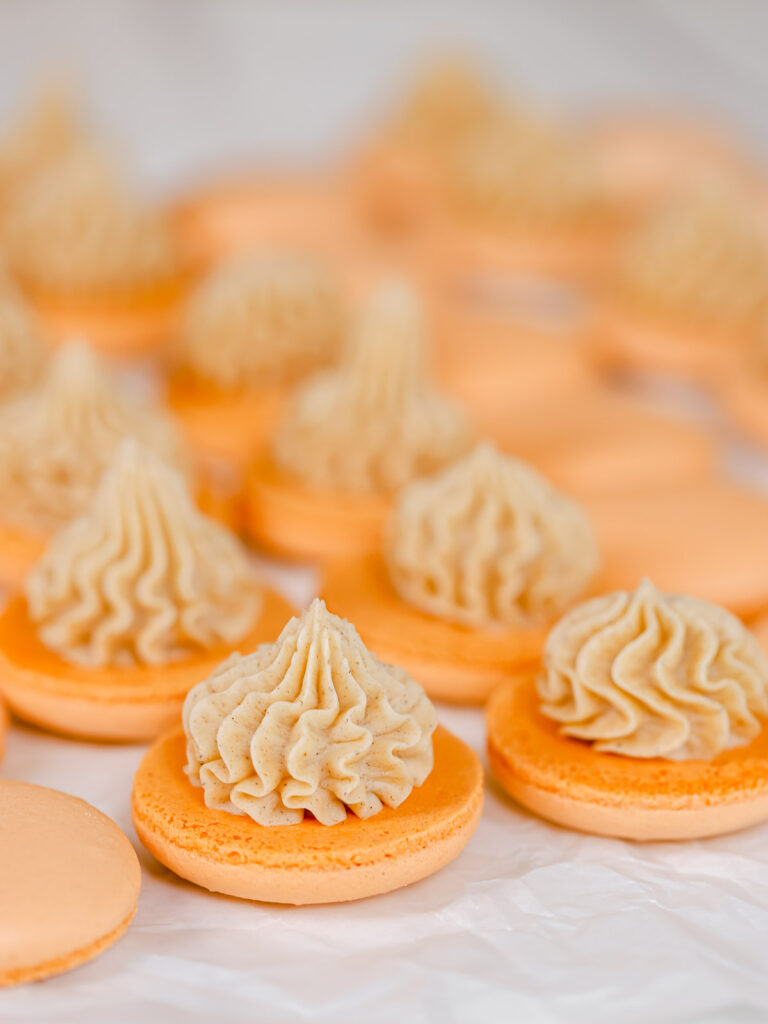 Buttercream piped on the macaron shell.