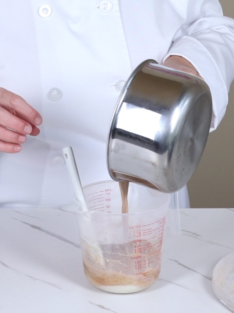 Pouring heavy cream into the chocolate.