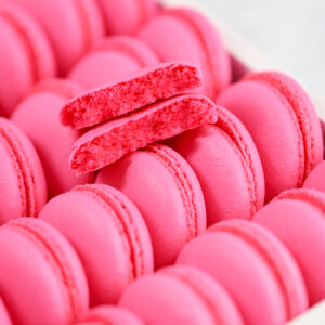 Pink macarons in the white box.