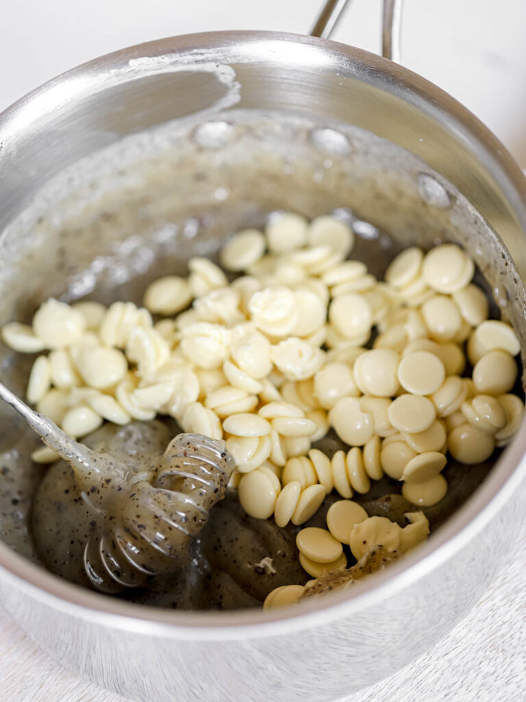 Saucepan with pastry cream and white chocolate.