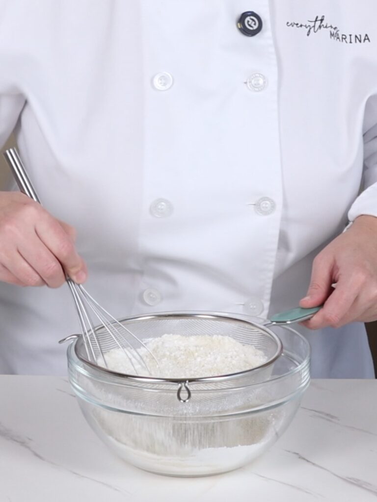 Mixing bowl with whisk and sifter.