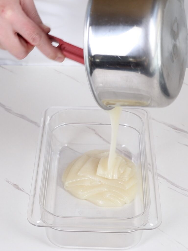 Transferring the flour mixture into a flat conatiner.