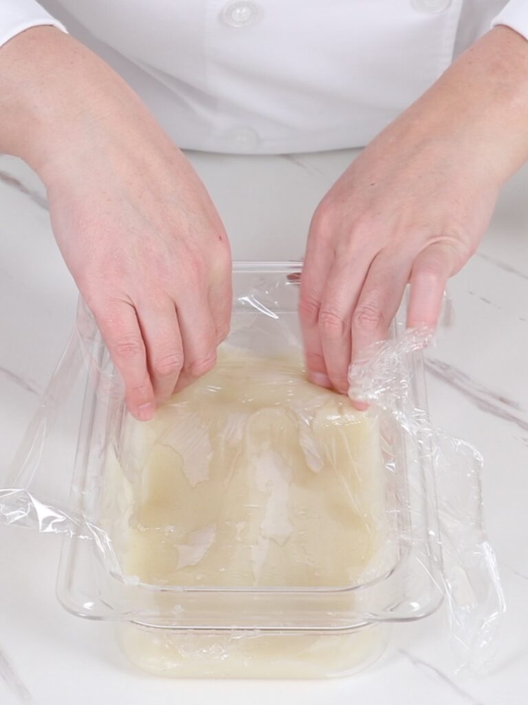 Cover the container with plastic wrap.