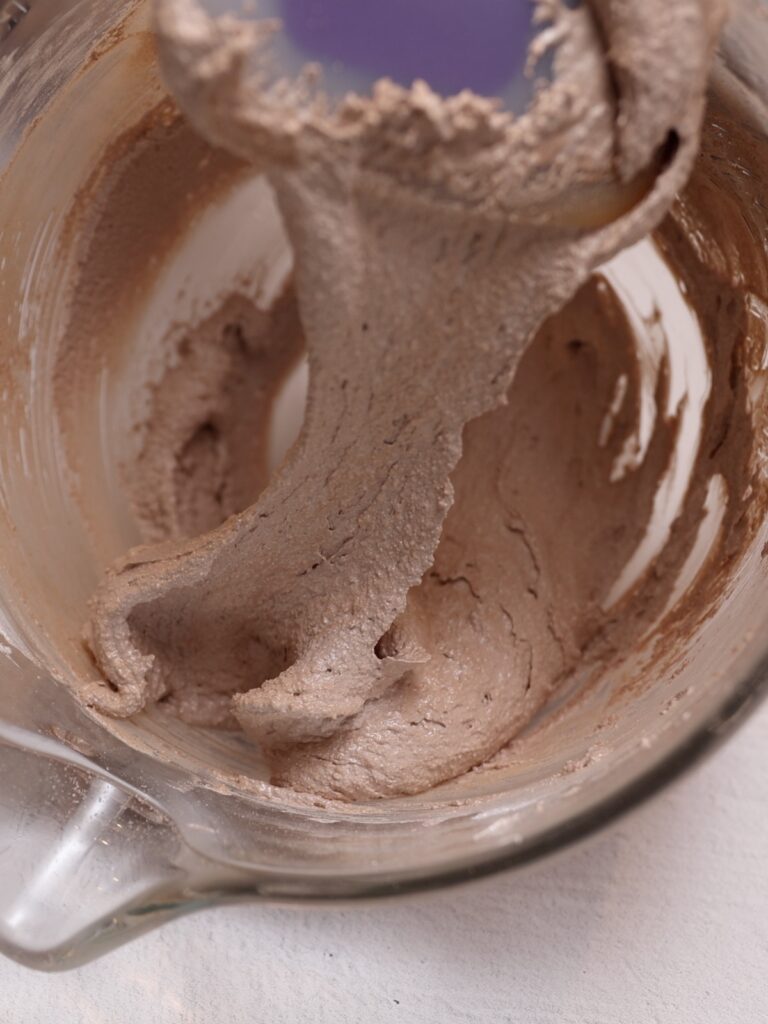 Chocolate macaronage in the mixing bowl. 