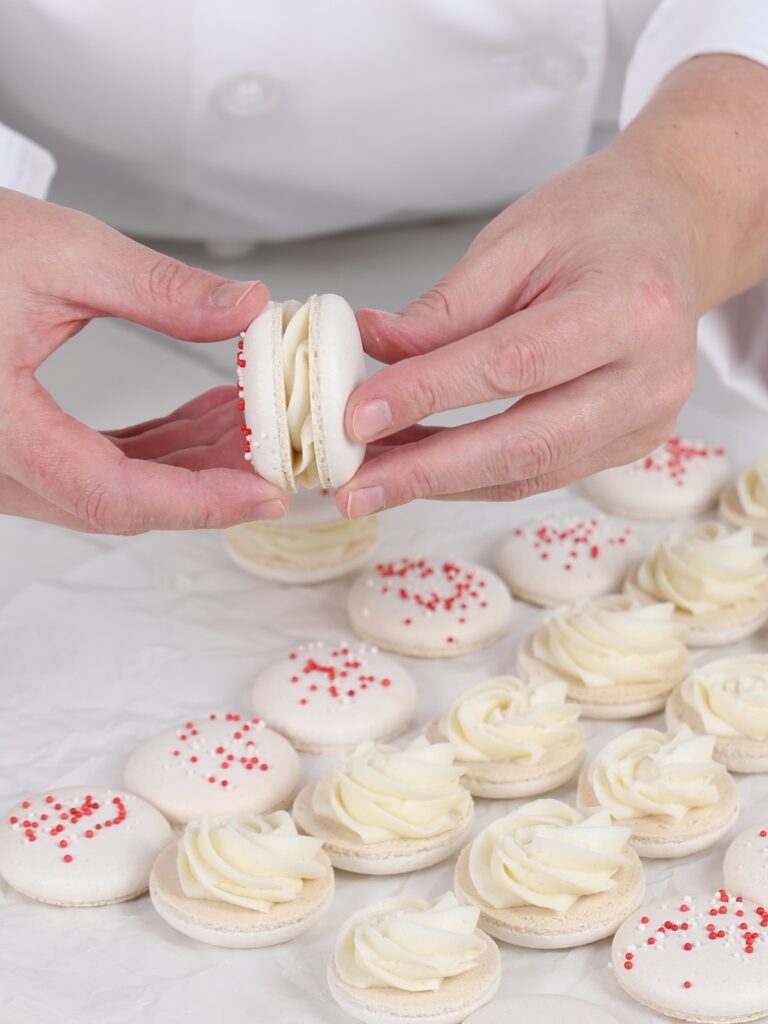 Assembling macarons.