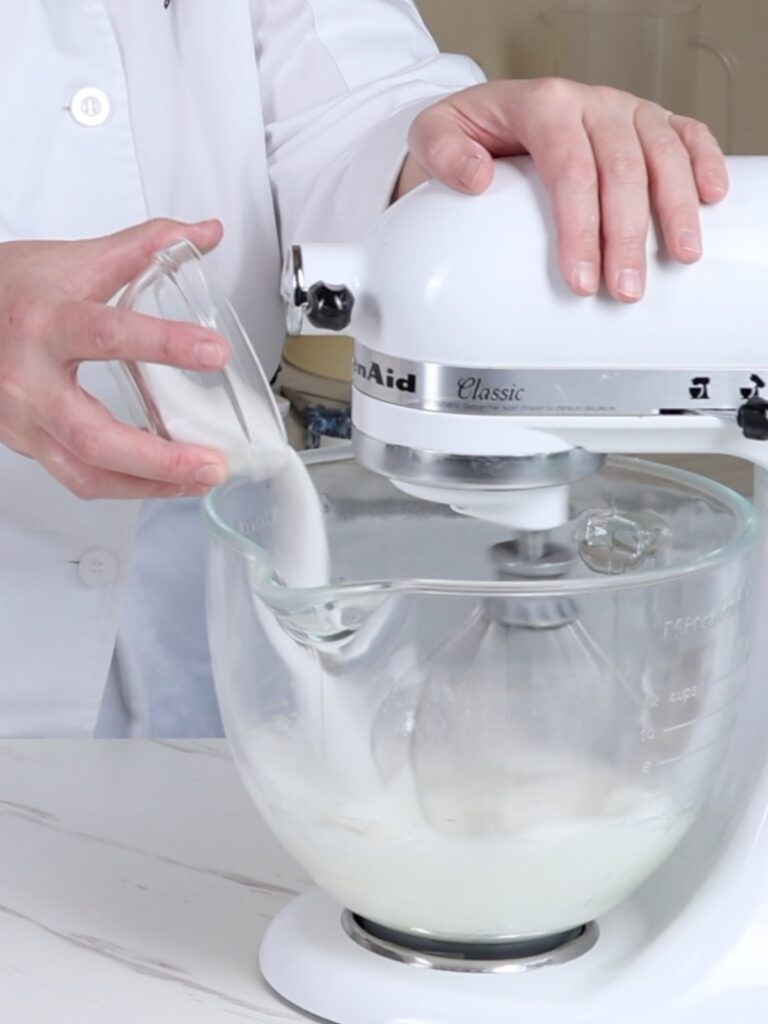 Add sugar to the mixing bowl. 