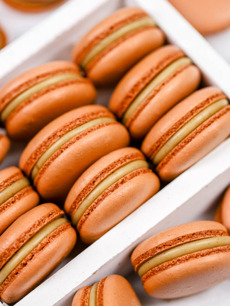 Gingerbread latte macarons in the box.