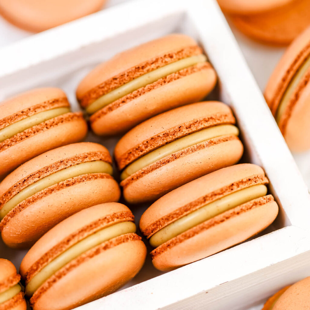Gingerbread latte macarons in the box.
