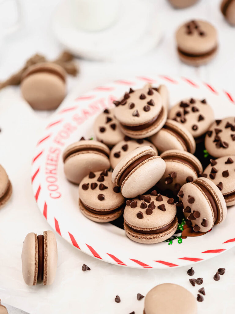 Chocolate chip macarons on the plate. 