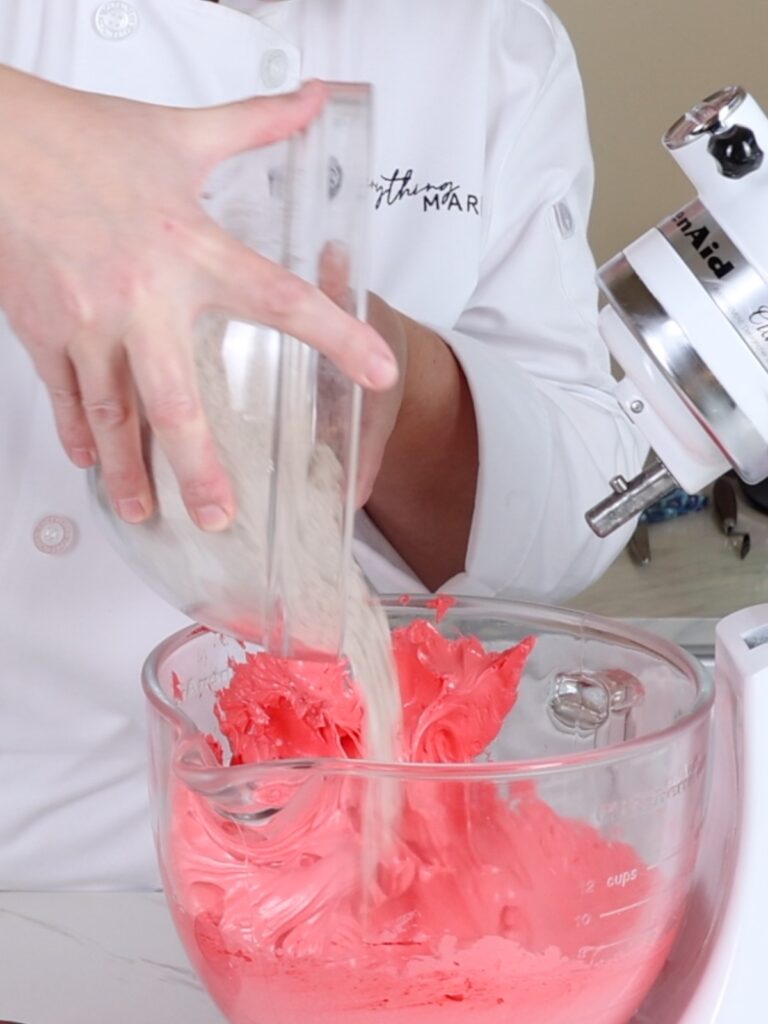 Add dry ingredients to the French meringue. 