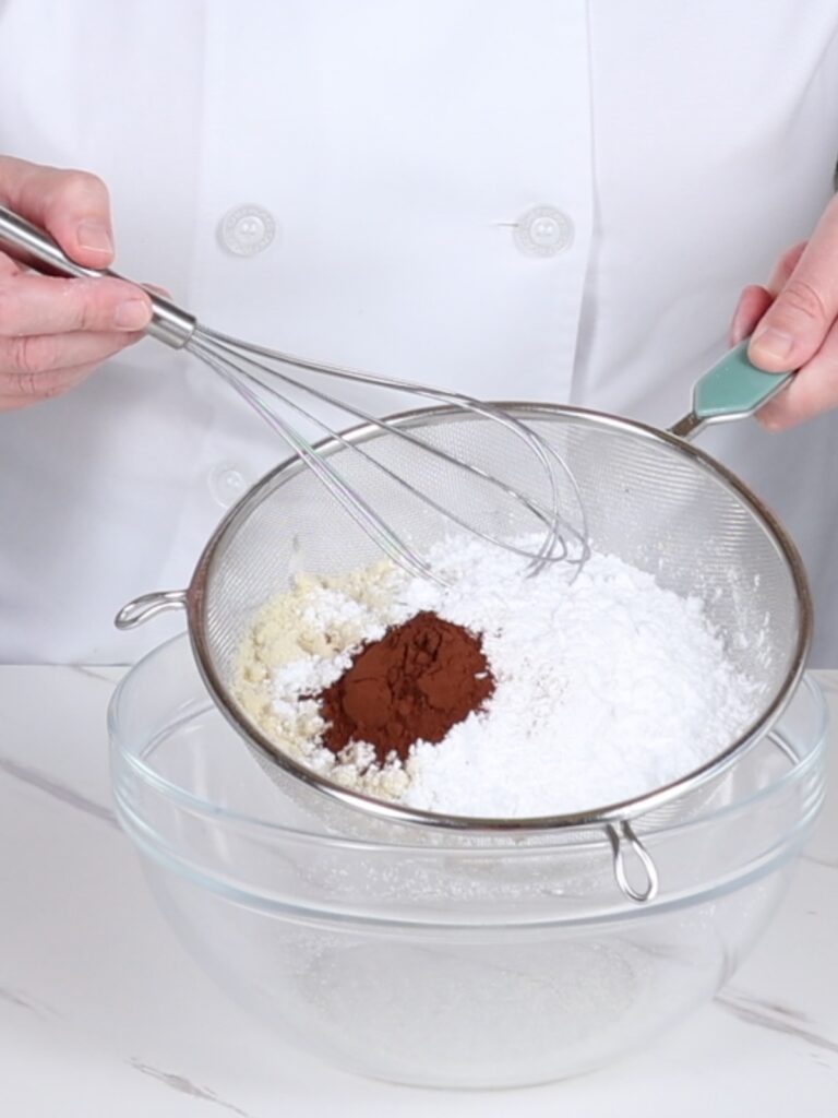Dry ingredients in the sifter with a whisk. 